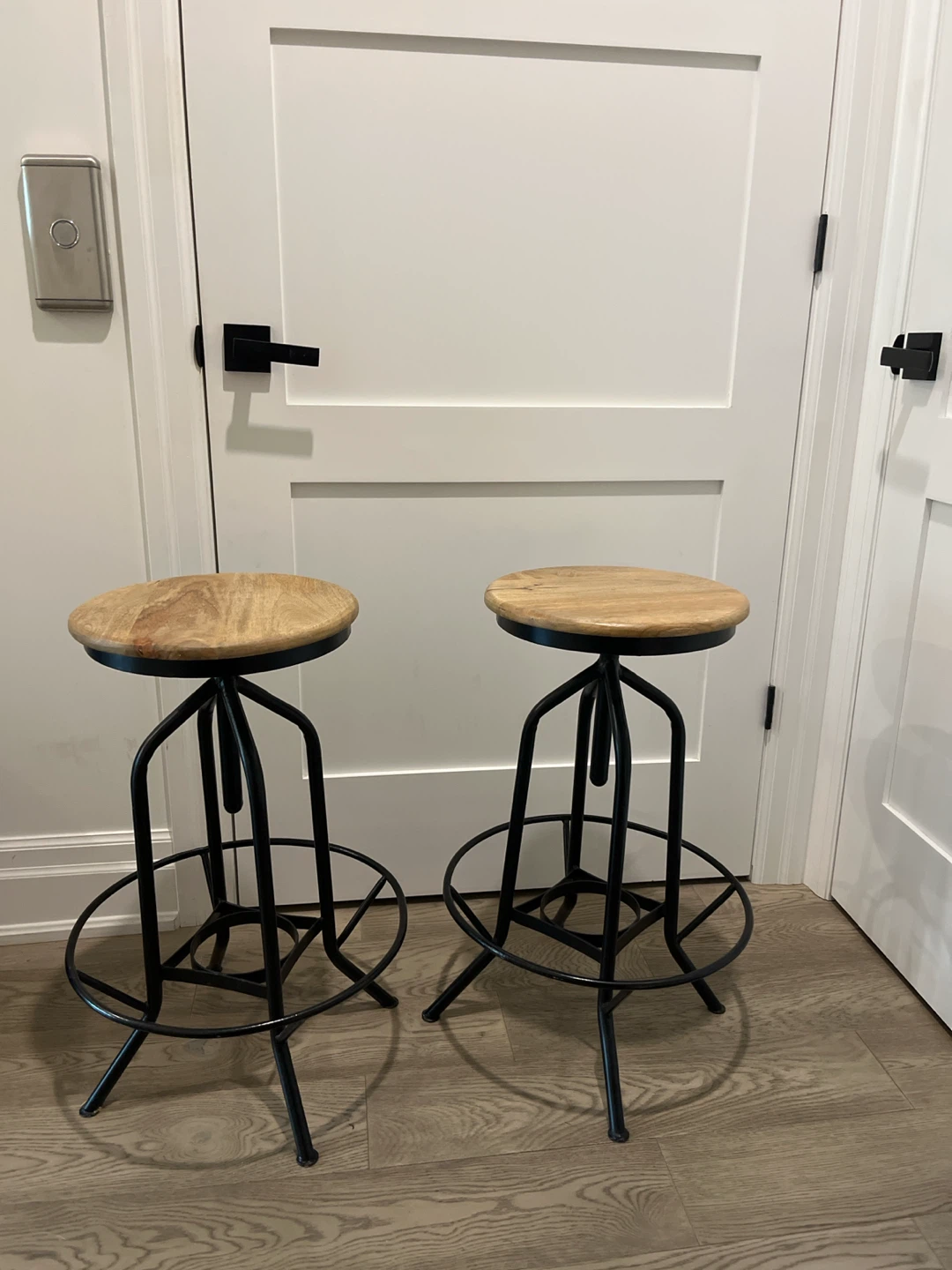 Two wood and metal bar stools