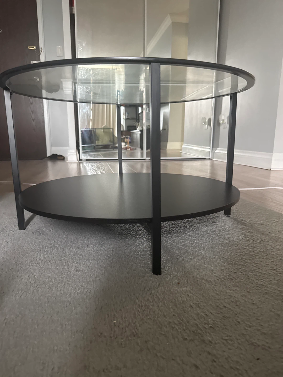 Round Glass and Black Metal Coffee Table