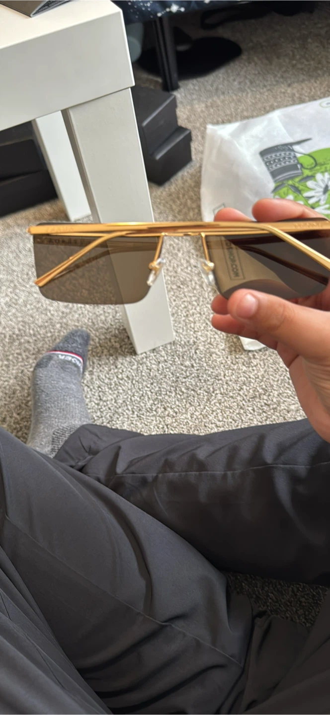 Prada Gold Rimless Sunglasses