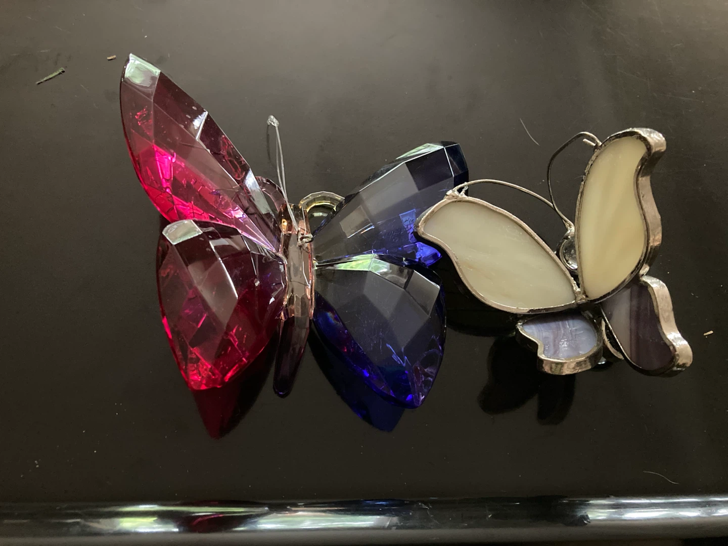 Two decorative butterfly ornaments