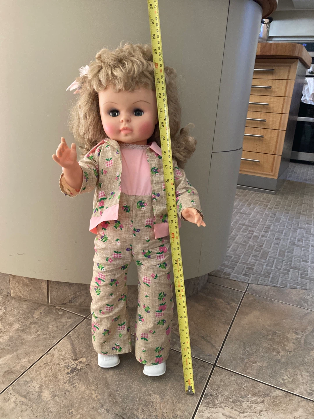 Vintage blonde doll in floral outfit