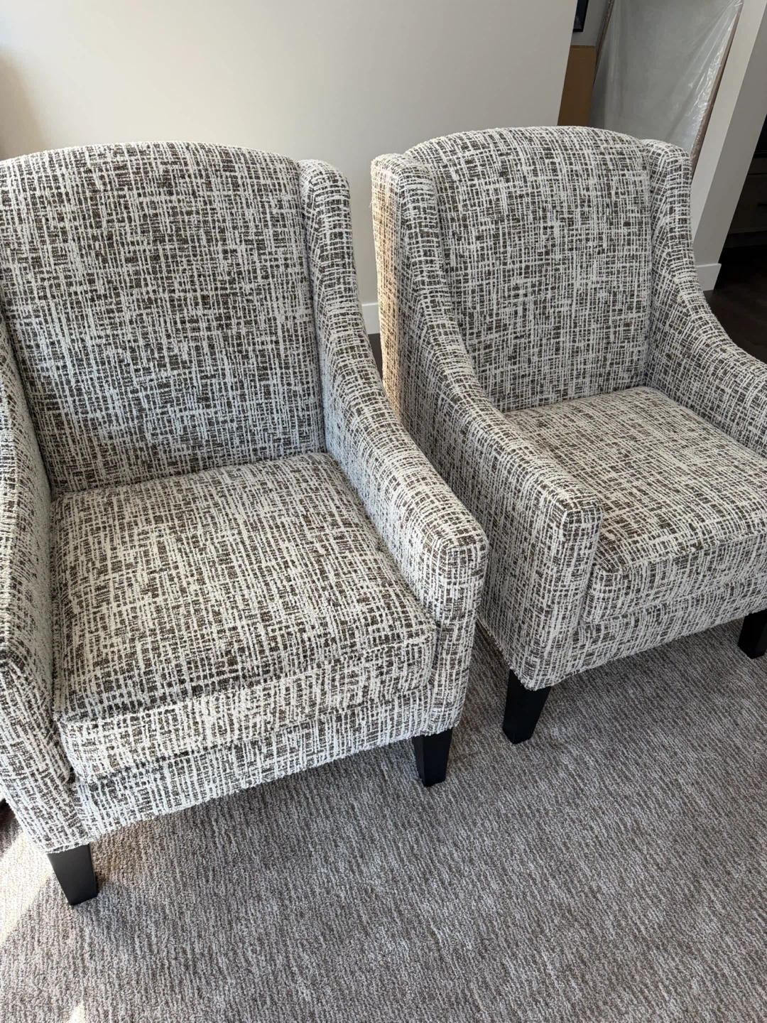 Set of two textured wingback accent chairs