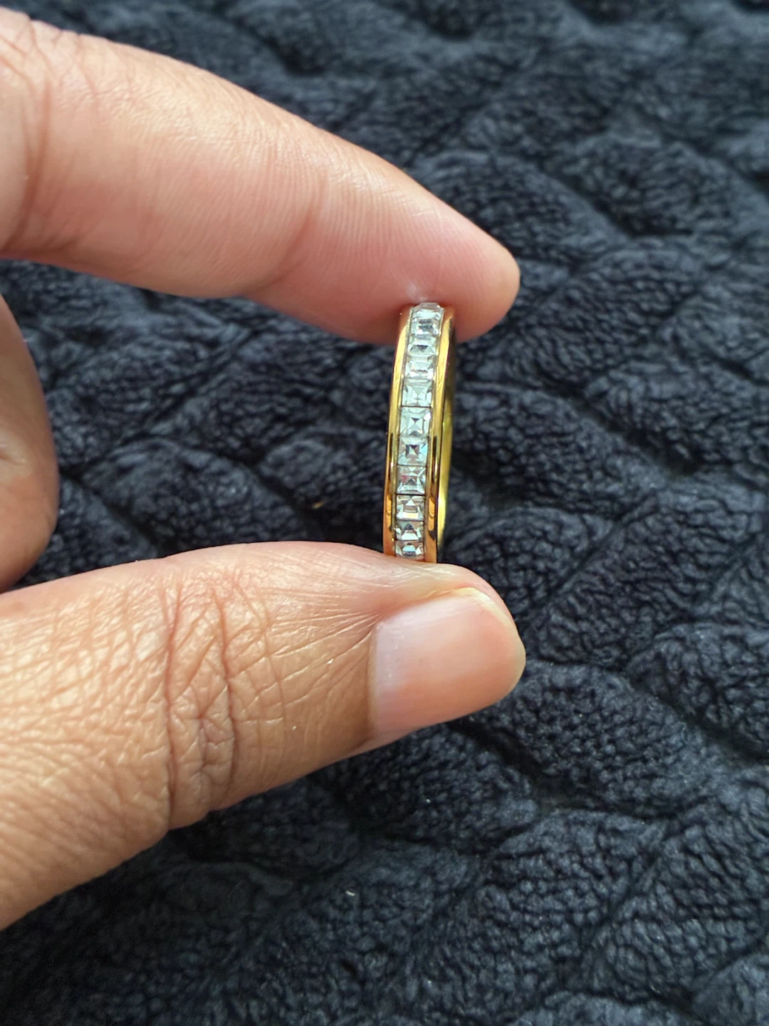 Gold-tone channel set stone band ring