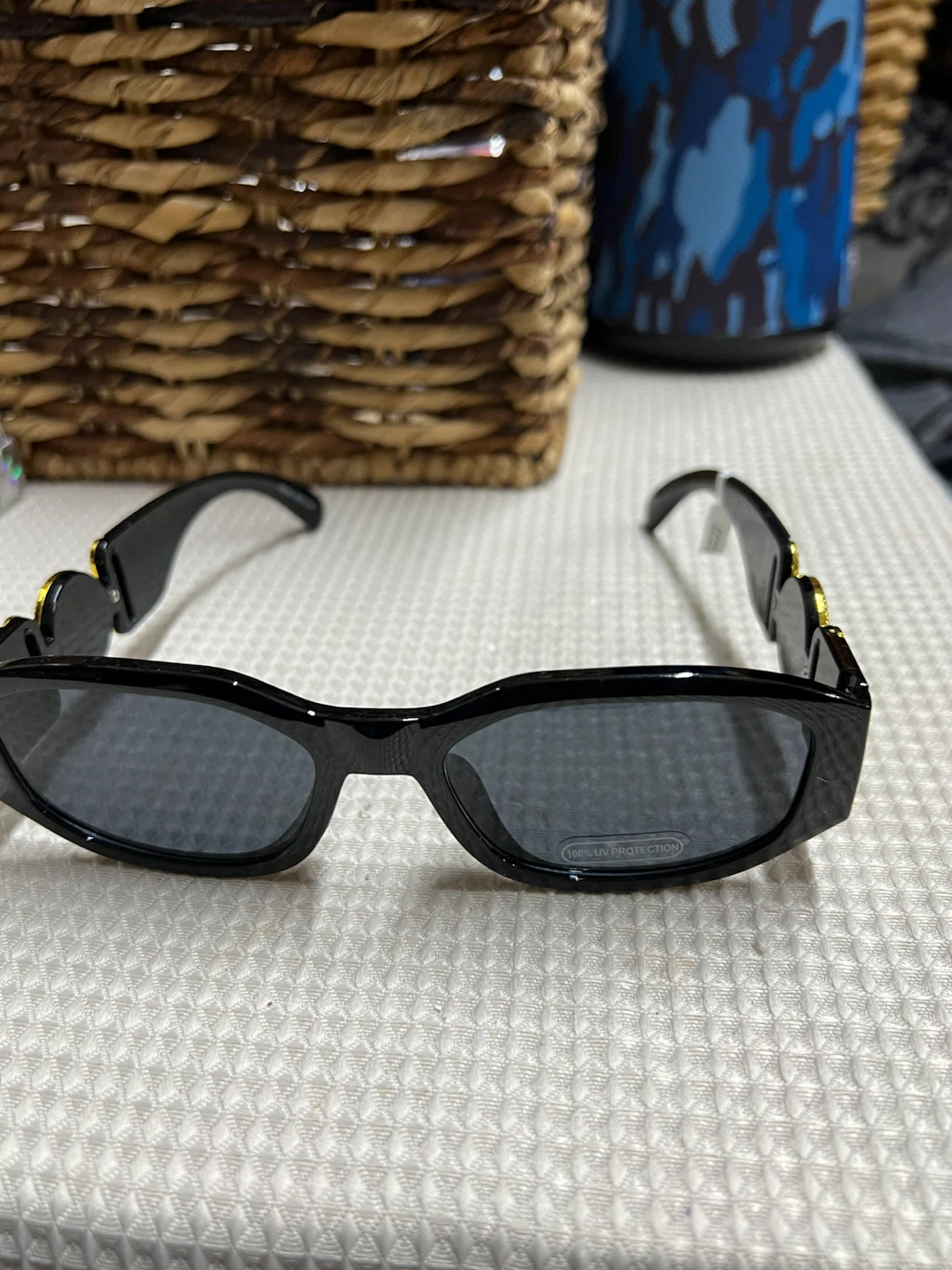 🏈 Black rectangular sunglasses with gold-tone accents
