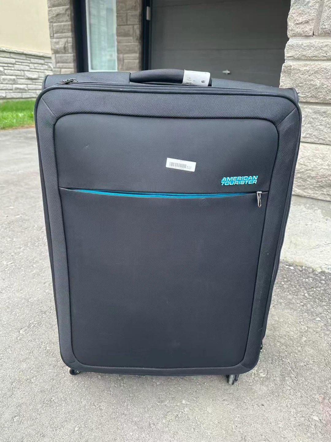 American Tourister black suitcase