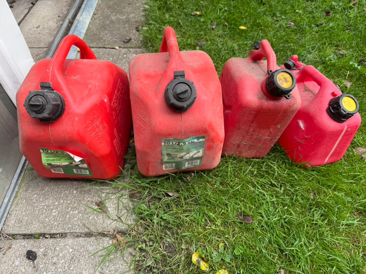 Four Plastic Gas Cans/Containers