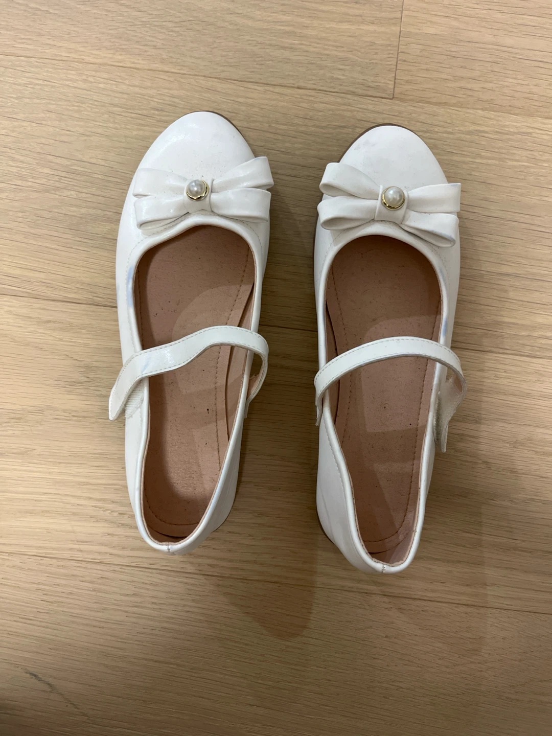 White flats with Pearl Bow 🏈