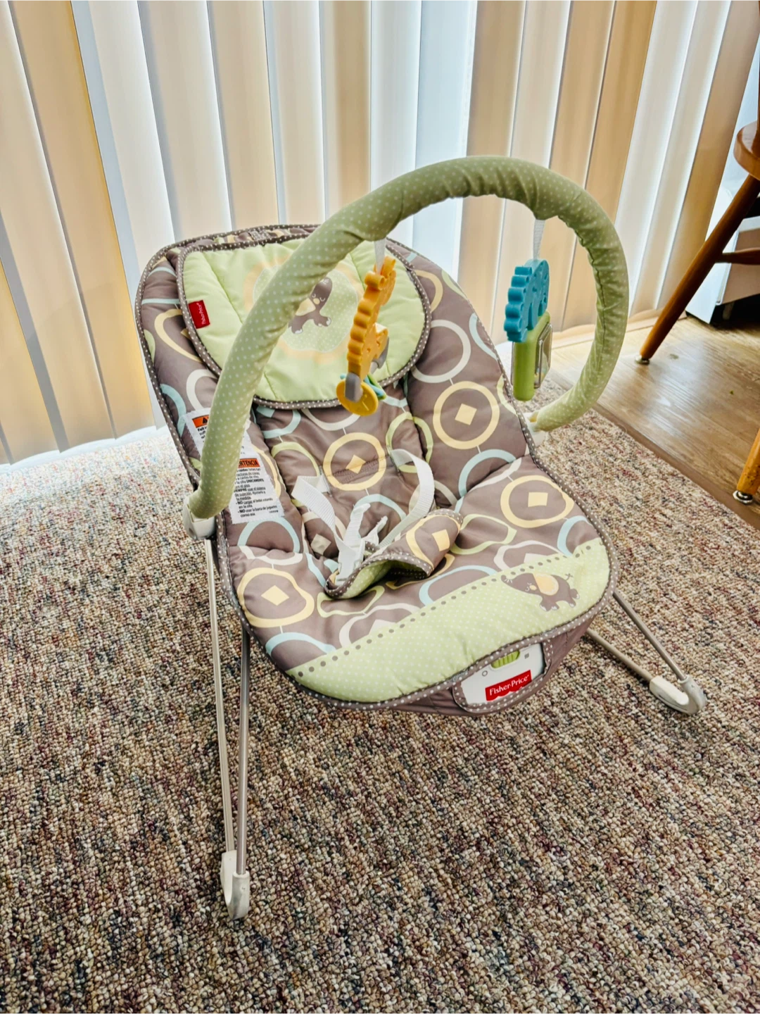 Baby bouncer seat with toy bar