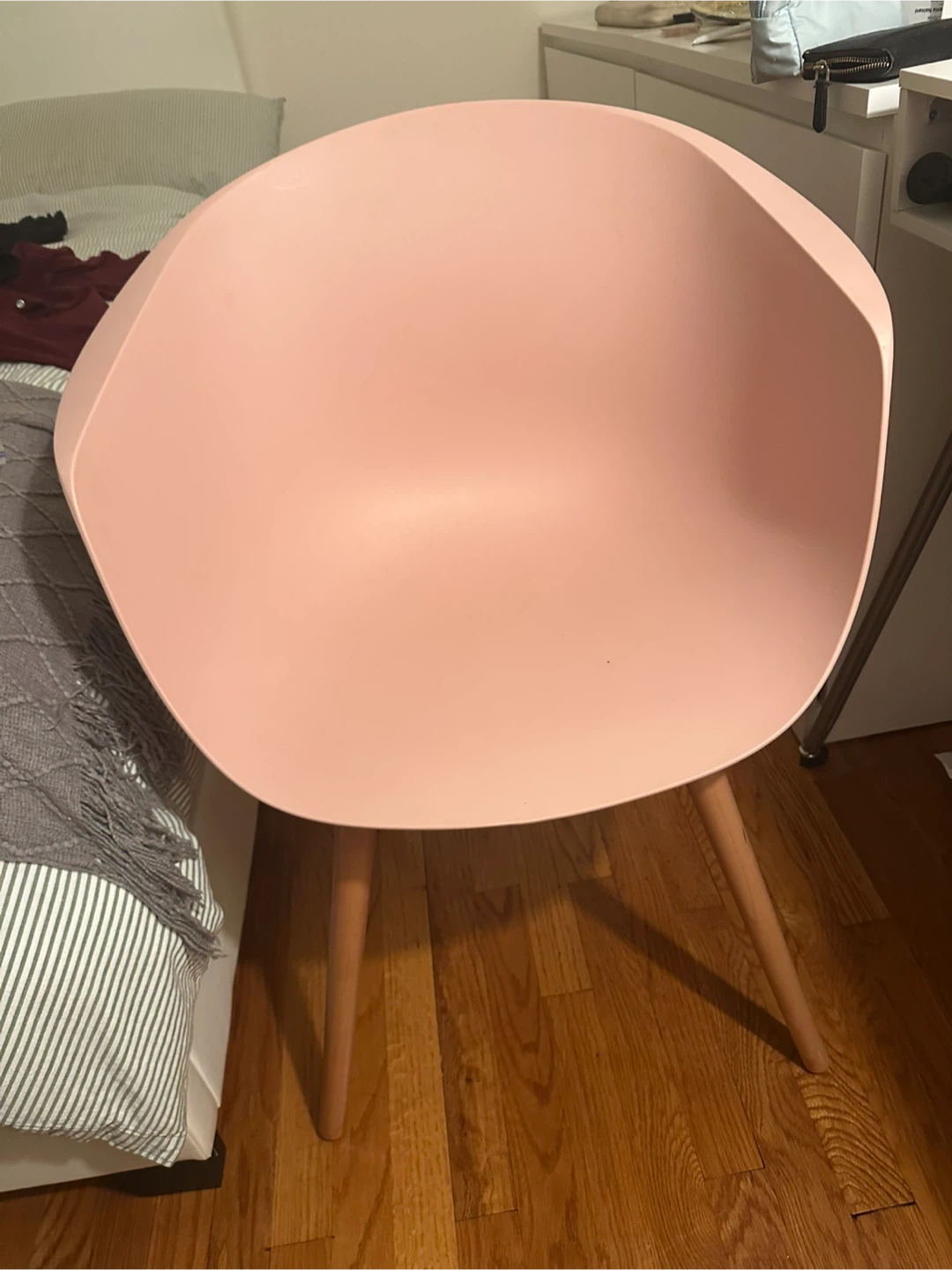 Pink modern accent chair with wooden legs