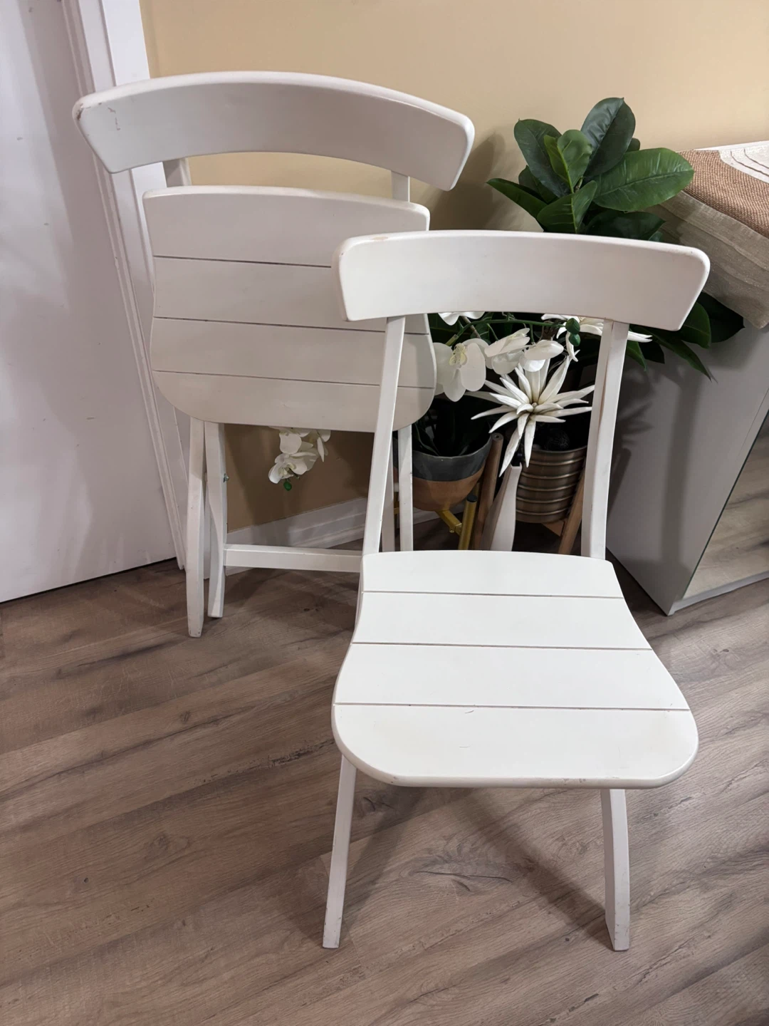 Two Wooden white folding chairs