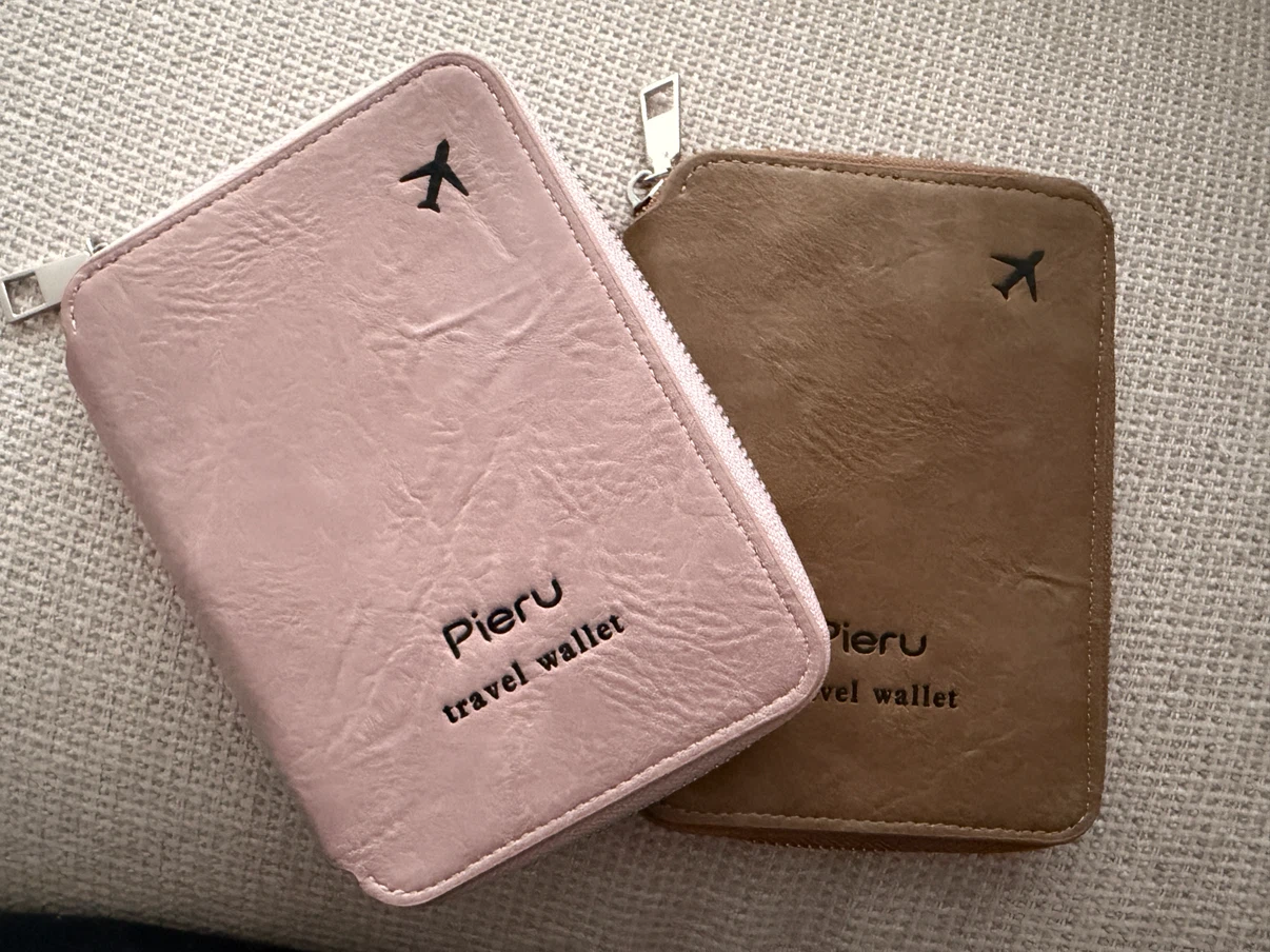 Two passport travel wallets