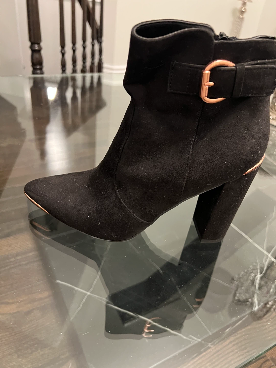 Black ankle boots with rose gold detailing