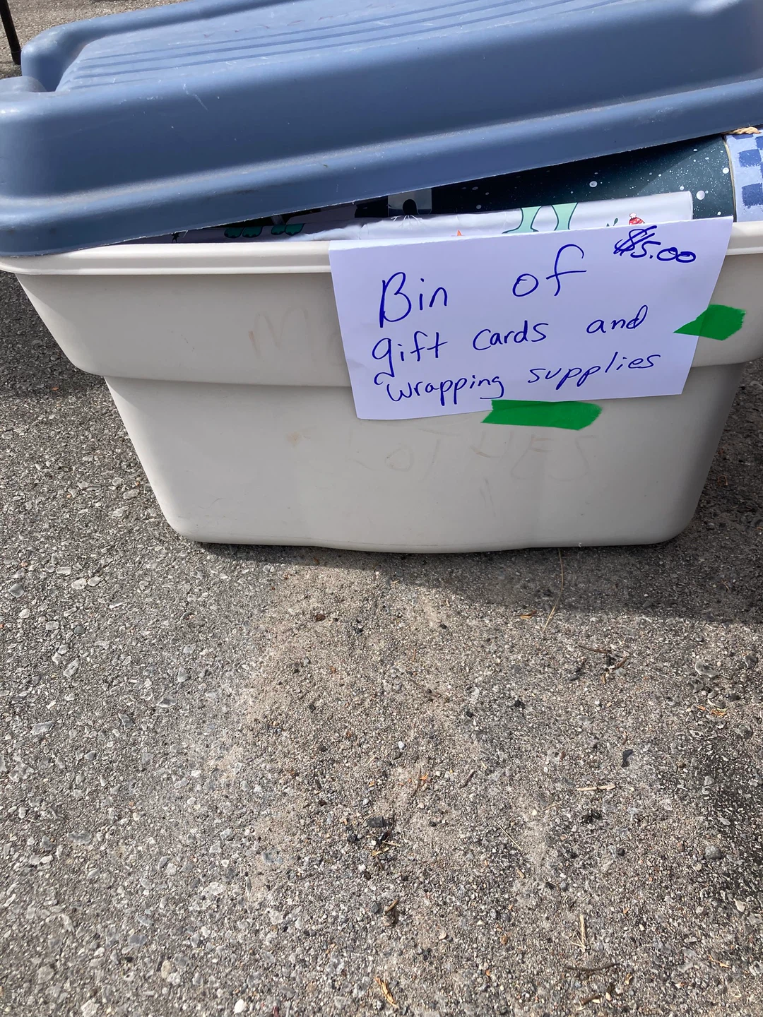 Bin of gift card boxes and wrapping supplies