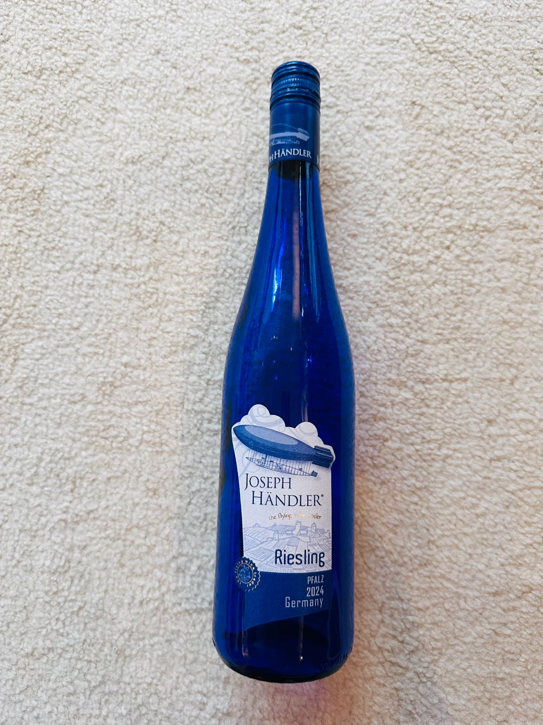 EMPTY glass bottle in blue🏈
