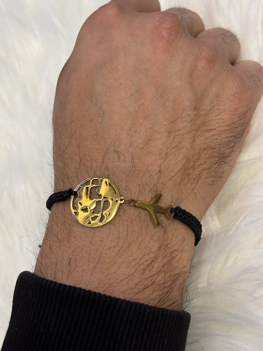 Gold-plated tone globe and airplane cord bracelet