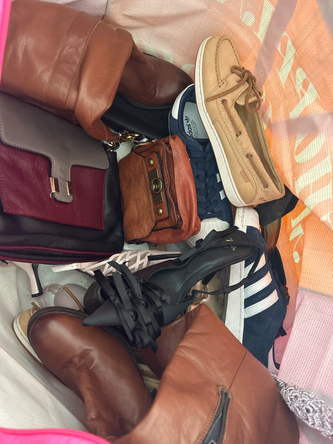 Bundle of leather shoes and bags