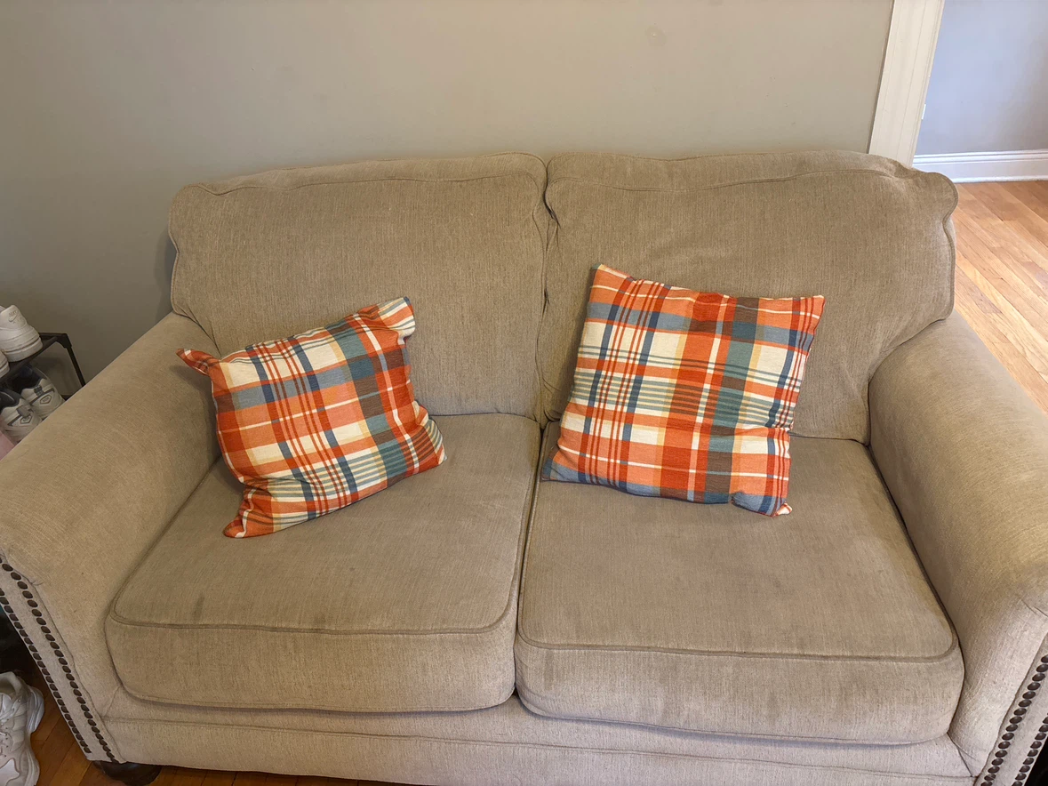 Beige Loveseat with Plaid Pillows