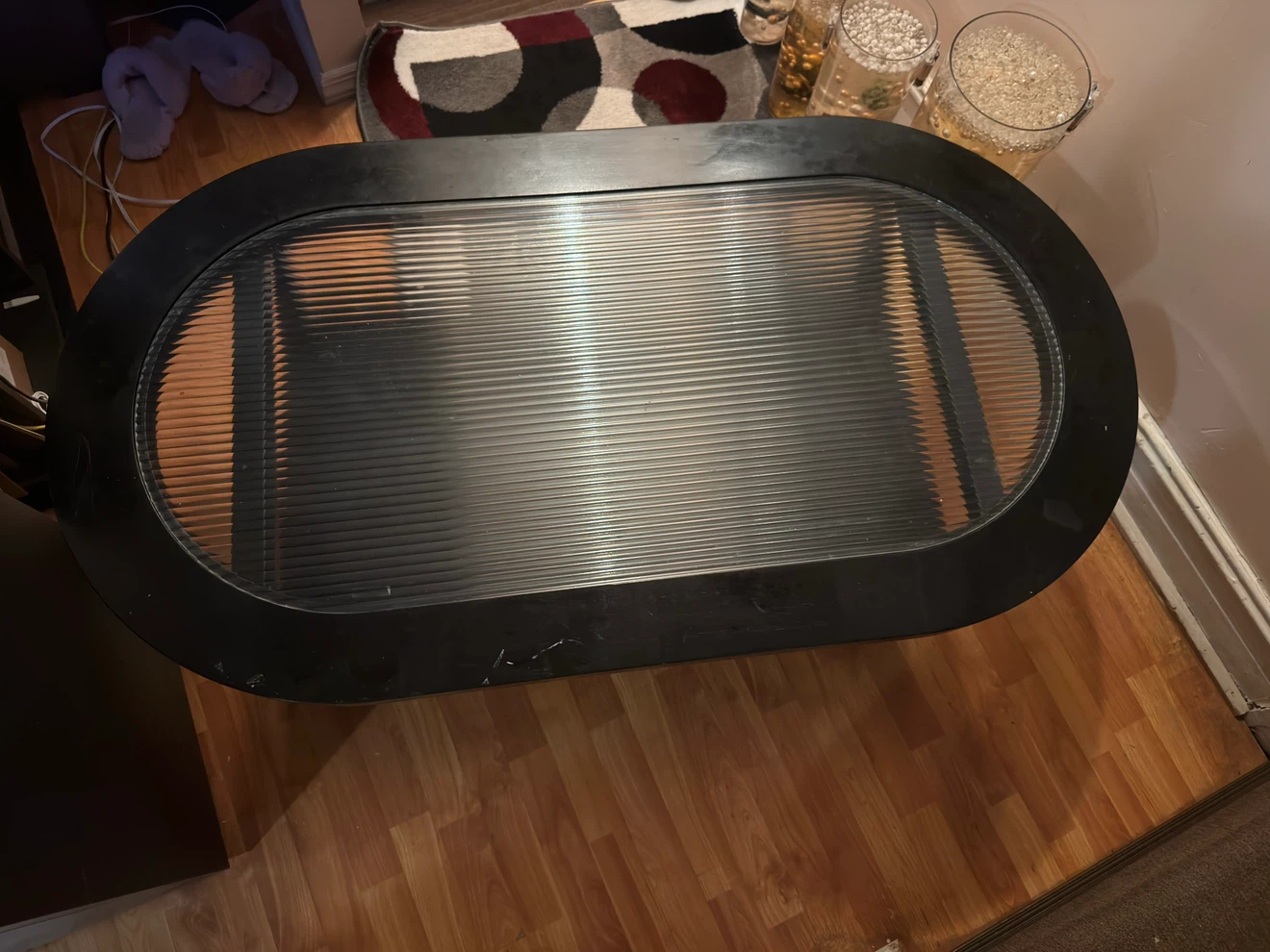 Black Oval Coffee Table with Ribbed Glass Top