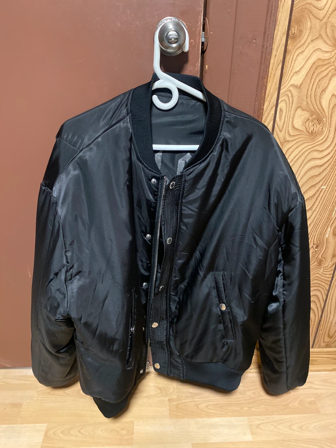 Stolen black bomber jacket