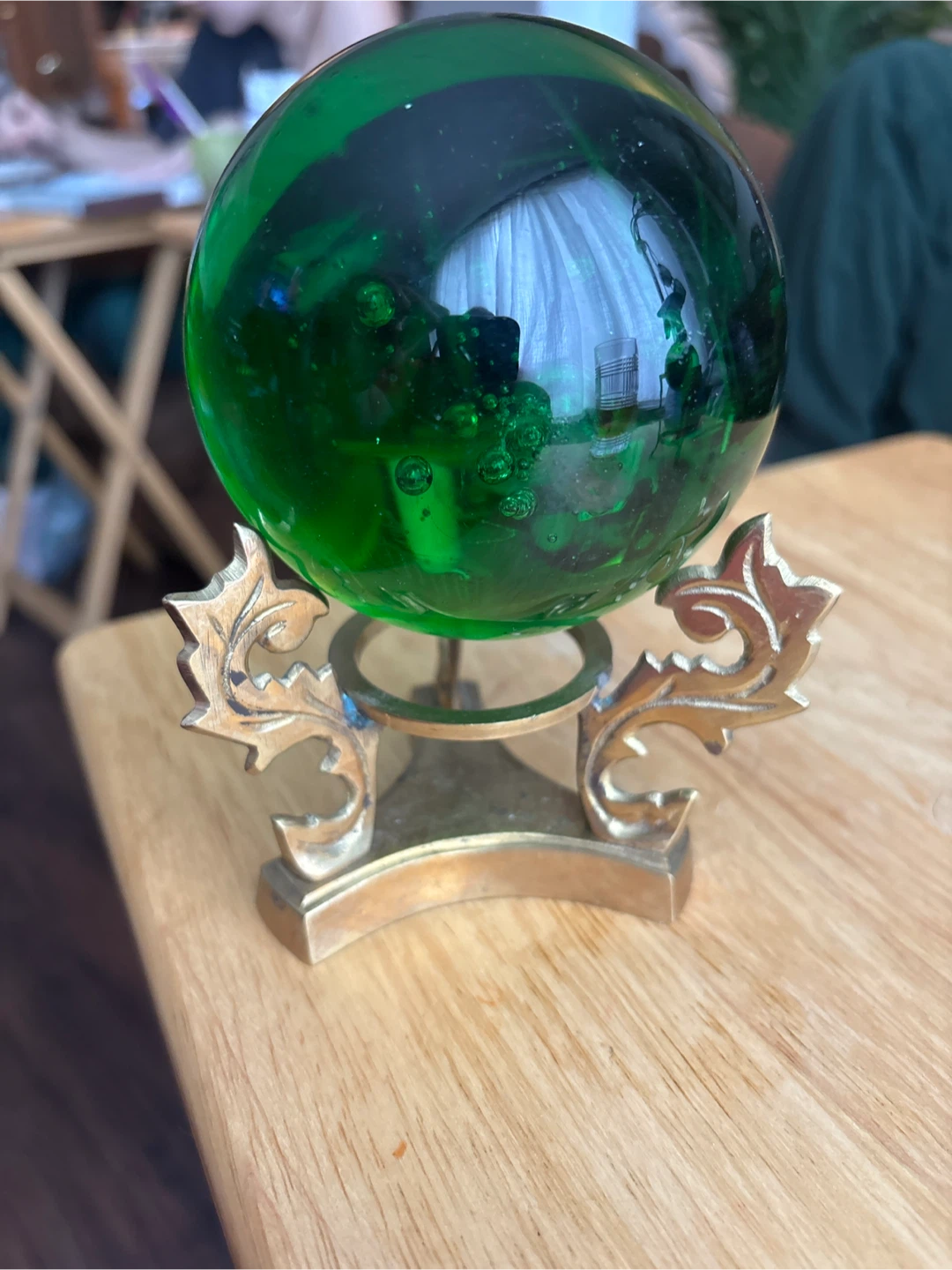 Green Glass Sphere on Brass Stand