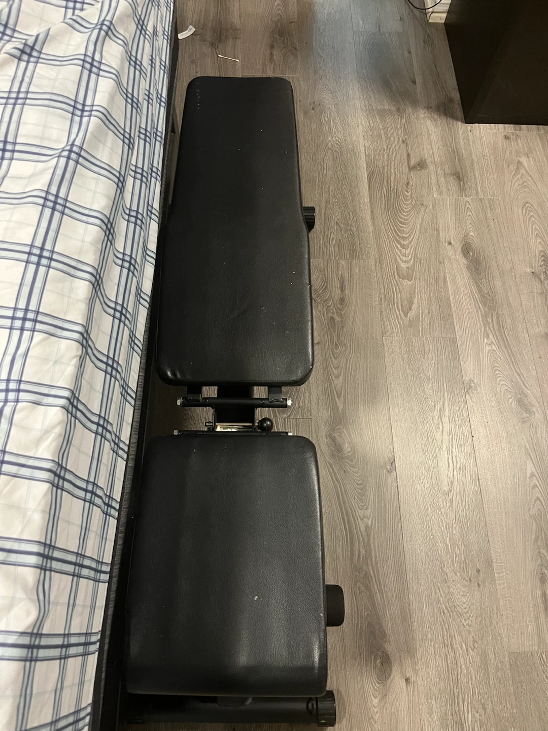 Black adjustable workout weight bench