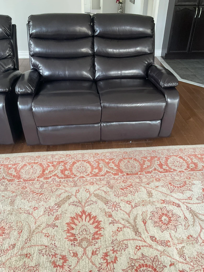 Dark brown leather loveseat recliner