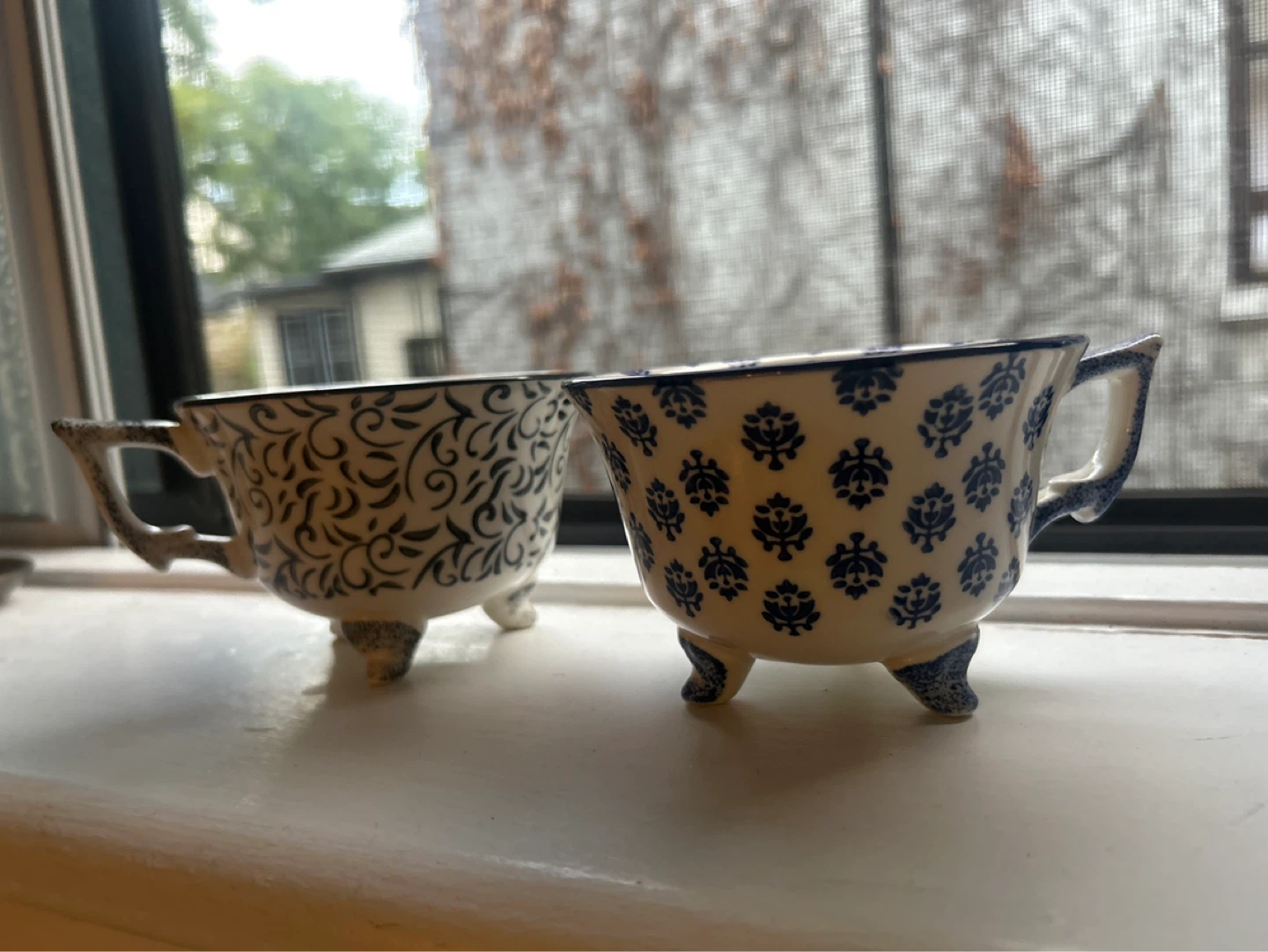 Two Decorative Footed Ceramic Cups
