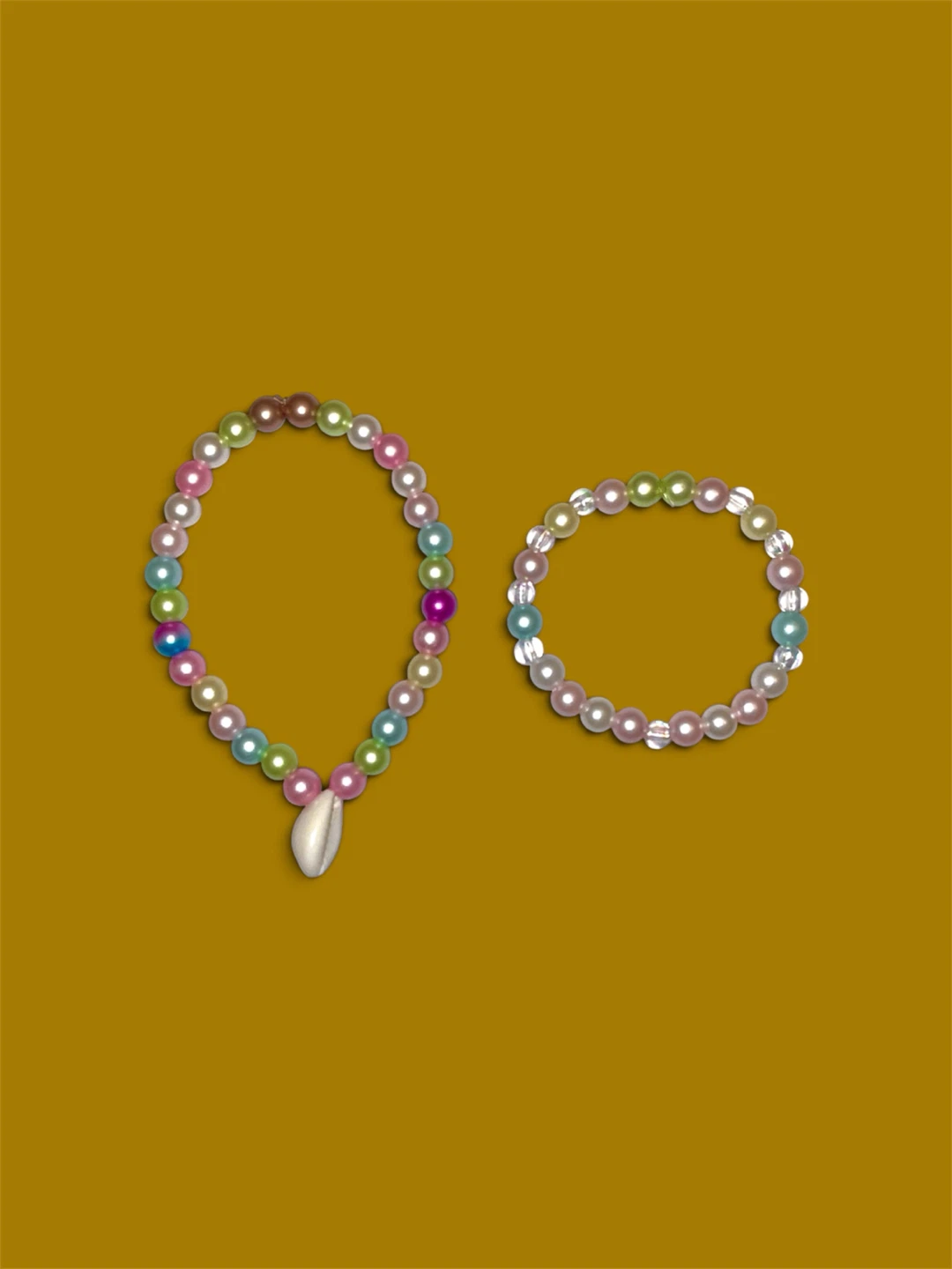 2 "Mother and Daughter" pearl bracelets.