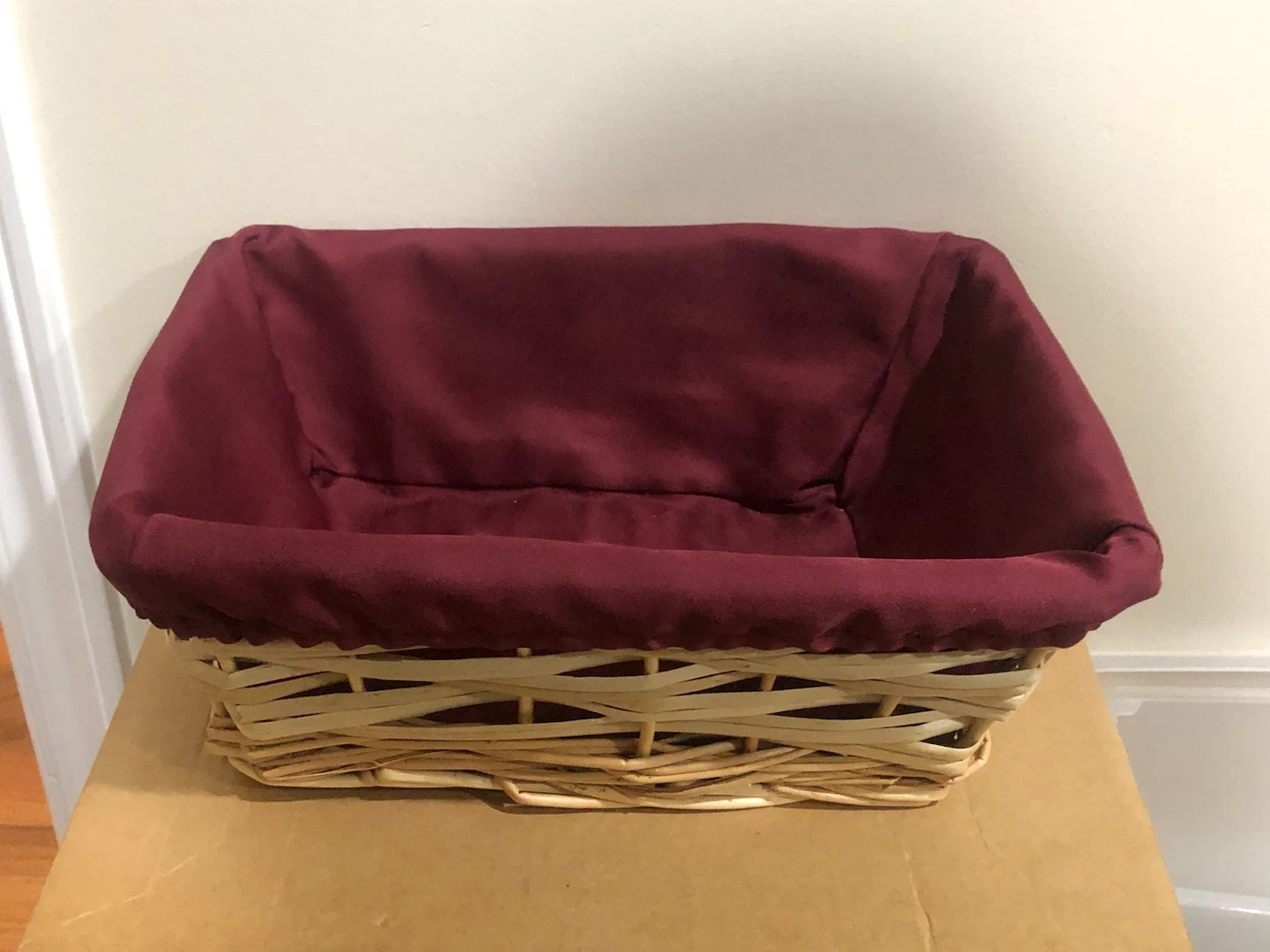 Wicker storage basket with burgundy liner 🏈