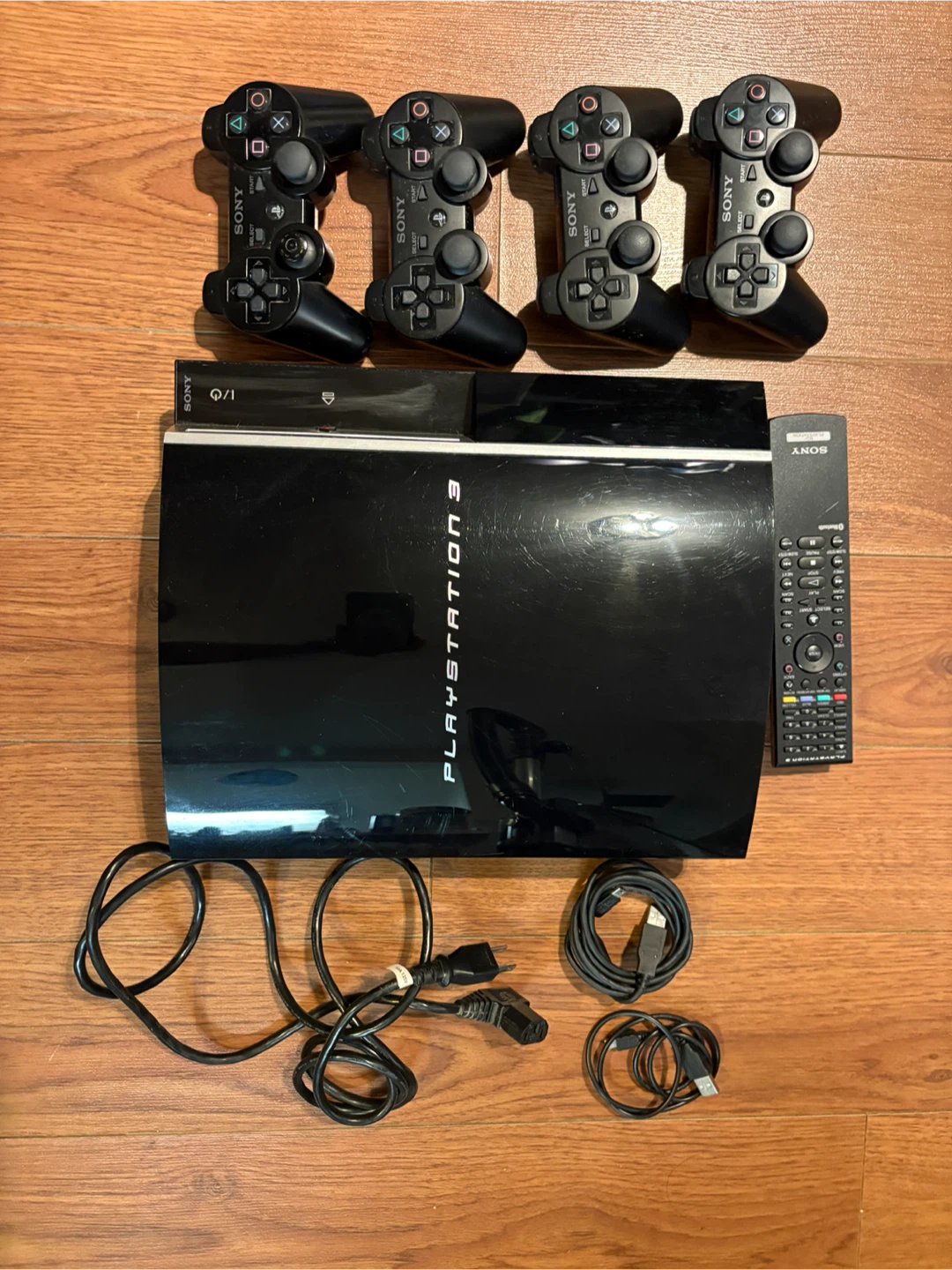 Sony PlayStation 3 Console with 4 Controllers
