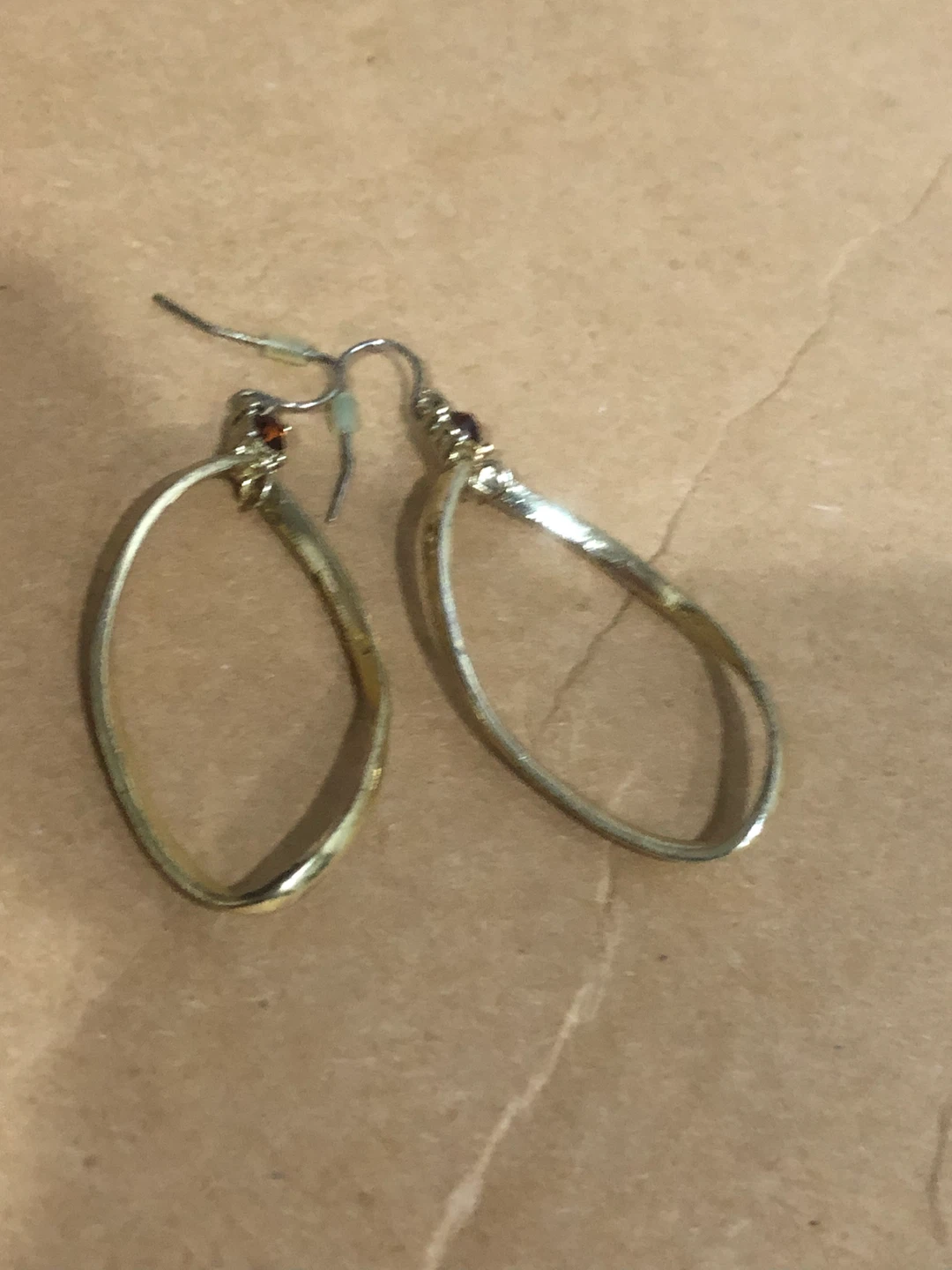 Gold-tone teardrop earrings with garnet accents 🏈