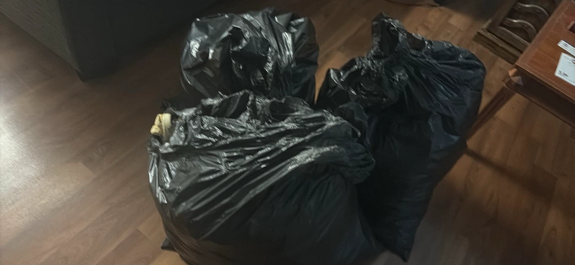 Three full bags of clothes and shoes