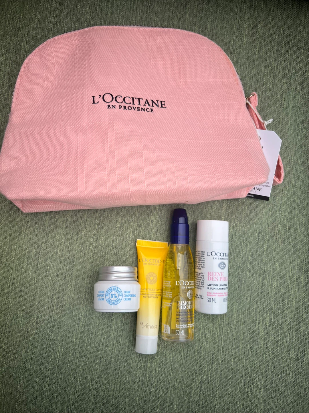 L'Occitane skincare set with pink pouch