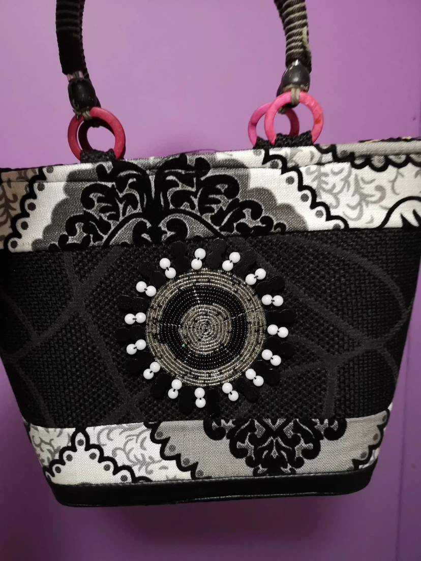 Black and white patterned handbag with beaded detail