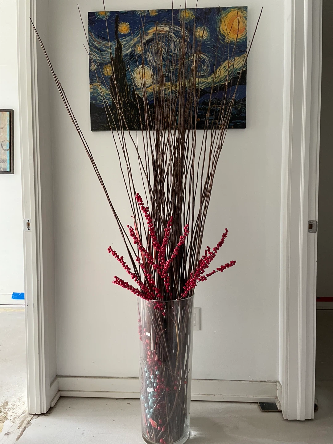 Tall Glass Vase with Decorative Twigs and Red Berries