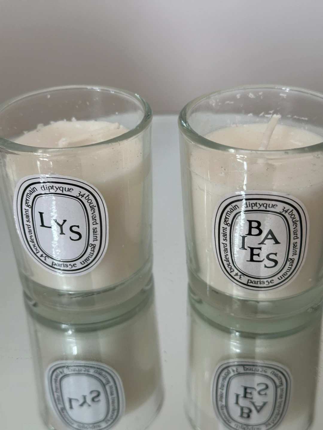 Two Diptyque Scented Candles (Baies and Lys)