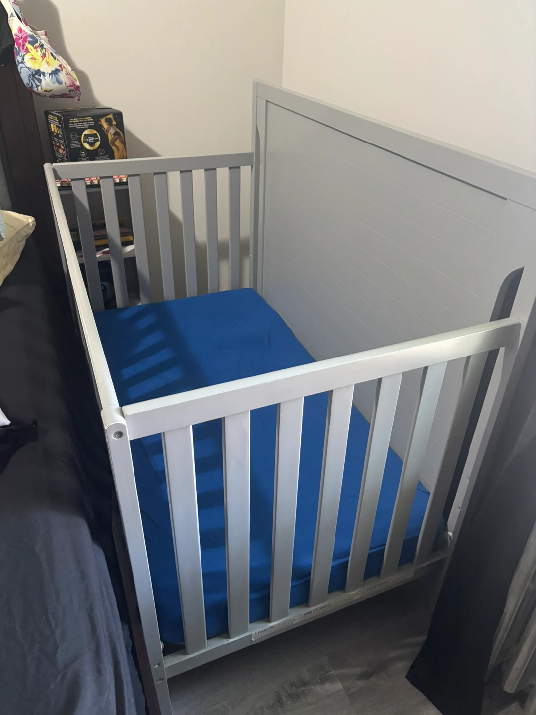 Gray baby crib