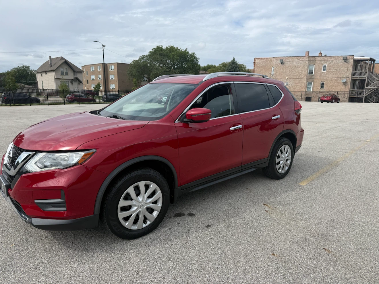 Red Nissan Rogue AWD