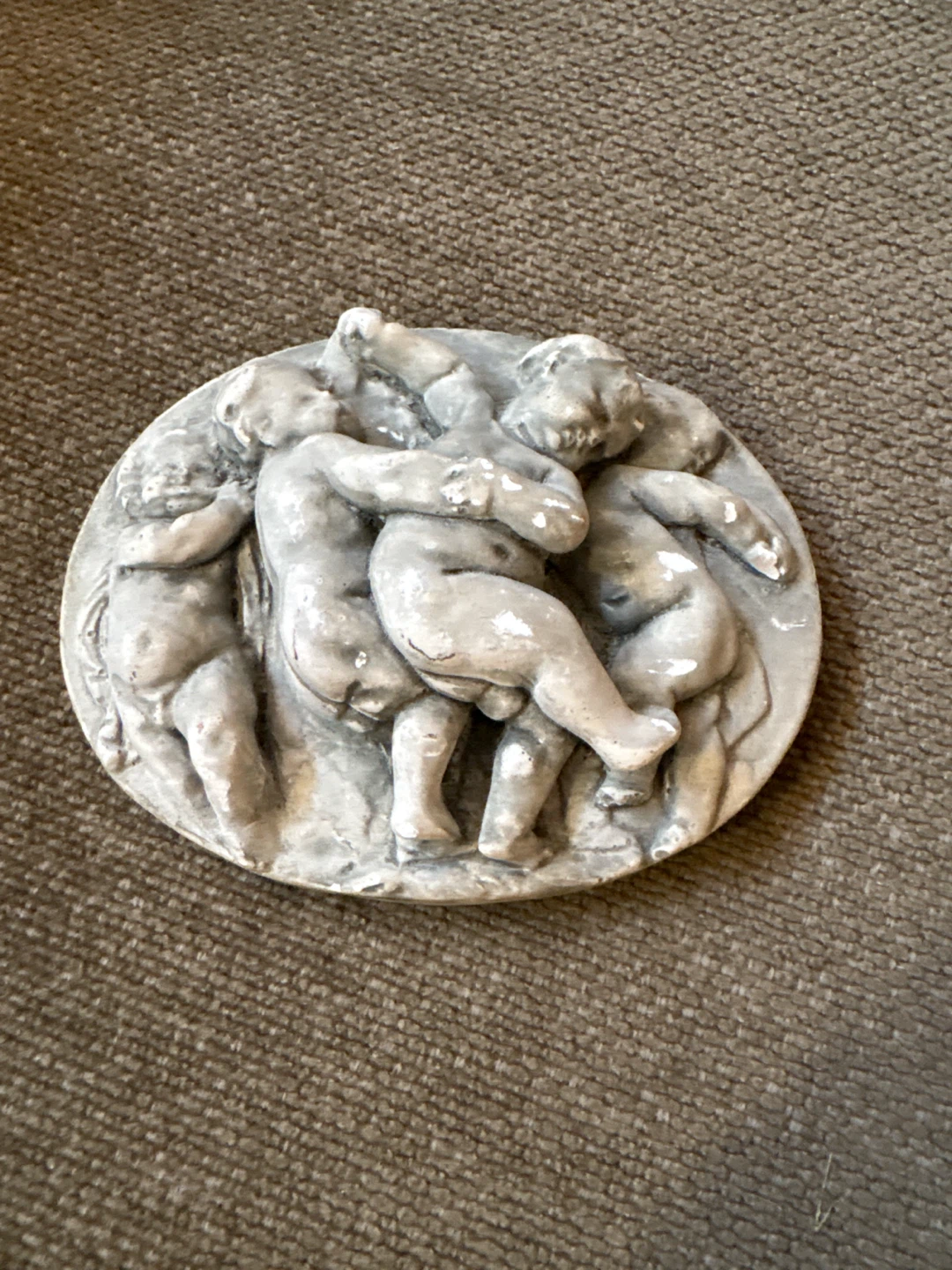 🏈 Oval Cherub Wall Plaque
