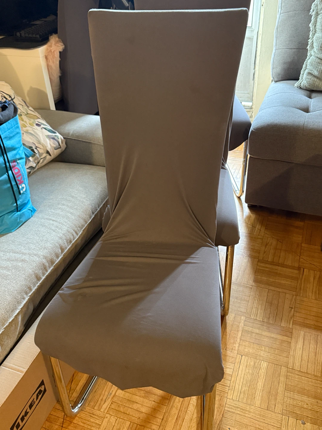 Dining chair with grey slipcover