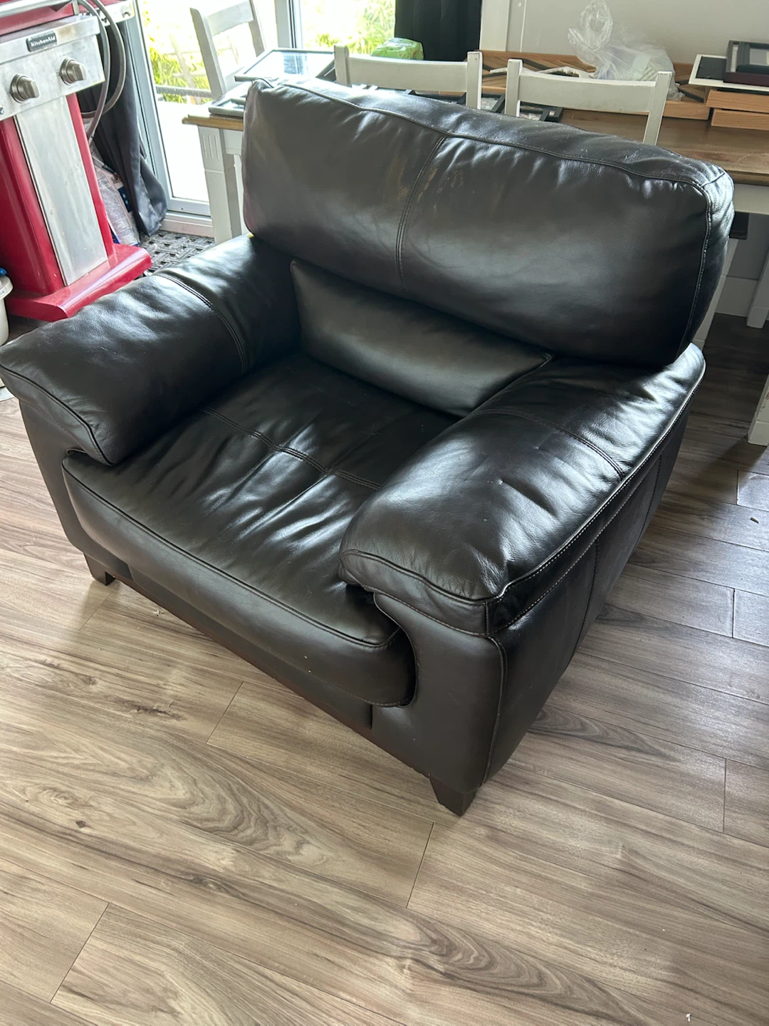 Dark brown leather armchair