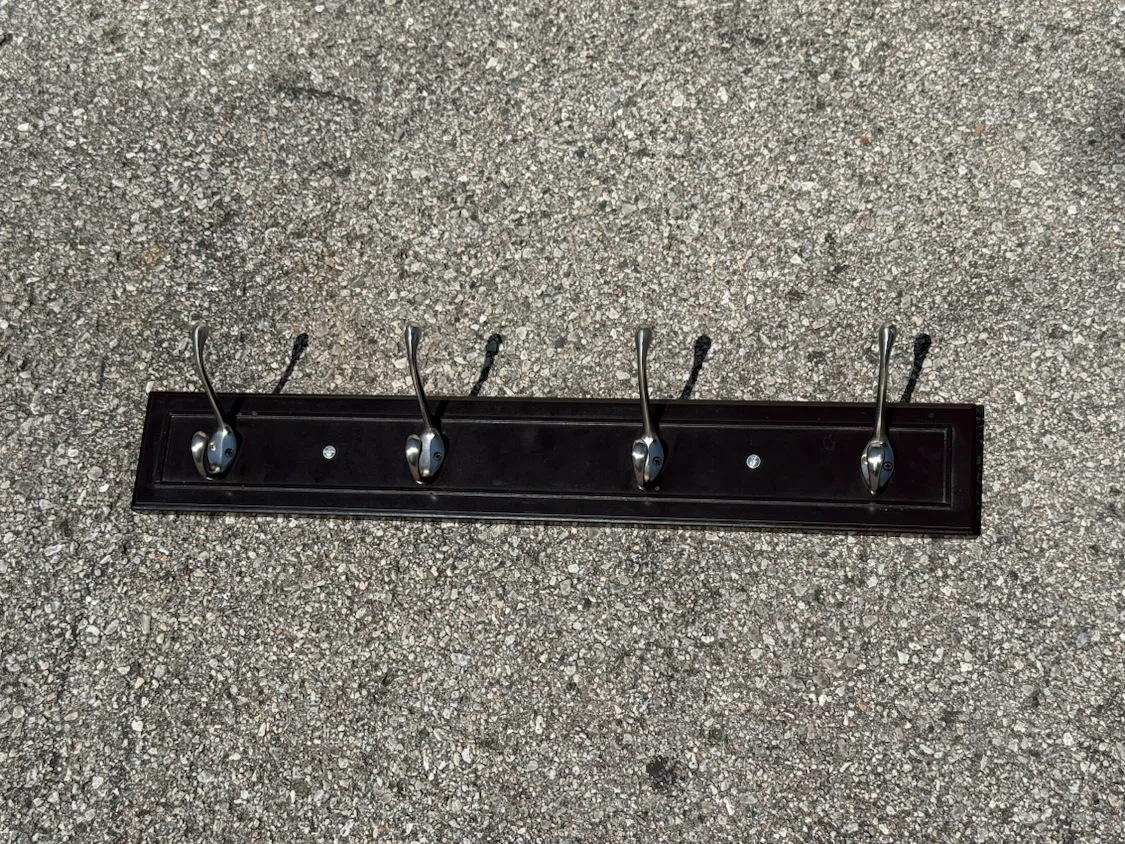Dark wood coat rack with 4 hooks