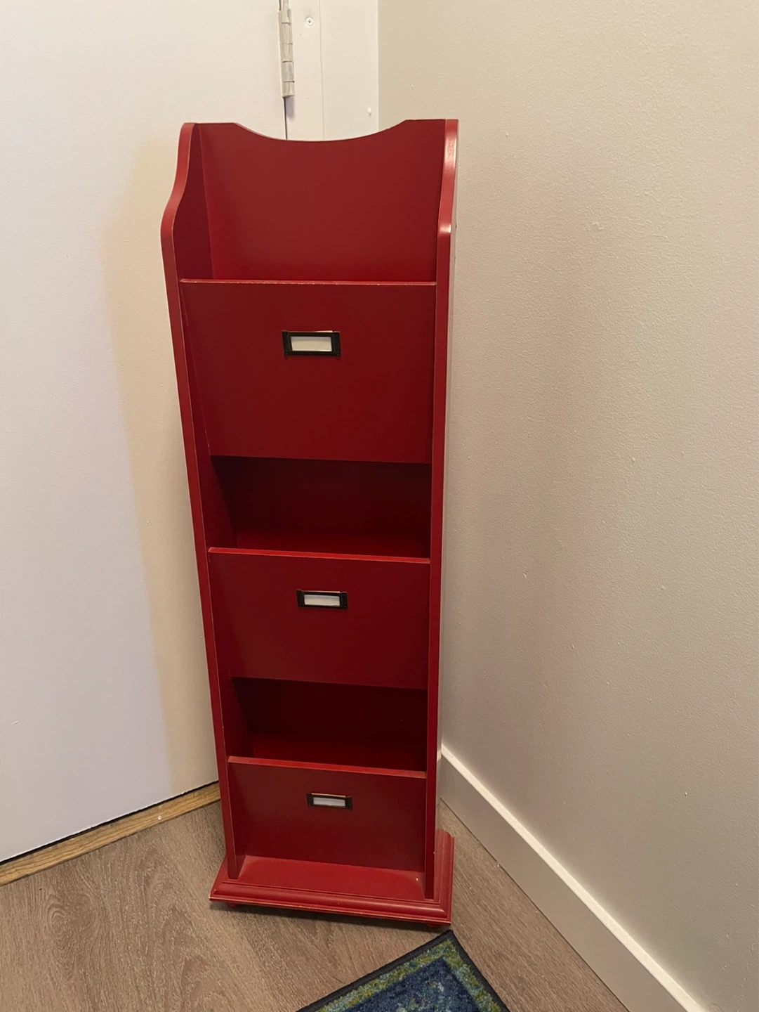 Red wall-mounted tiered storage organizer