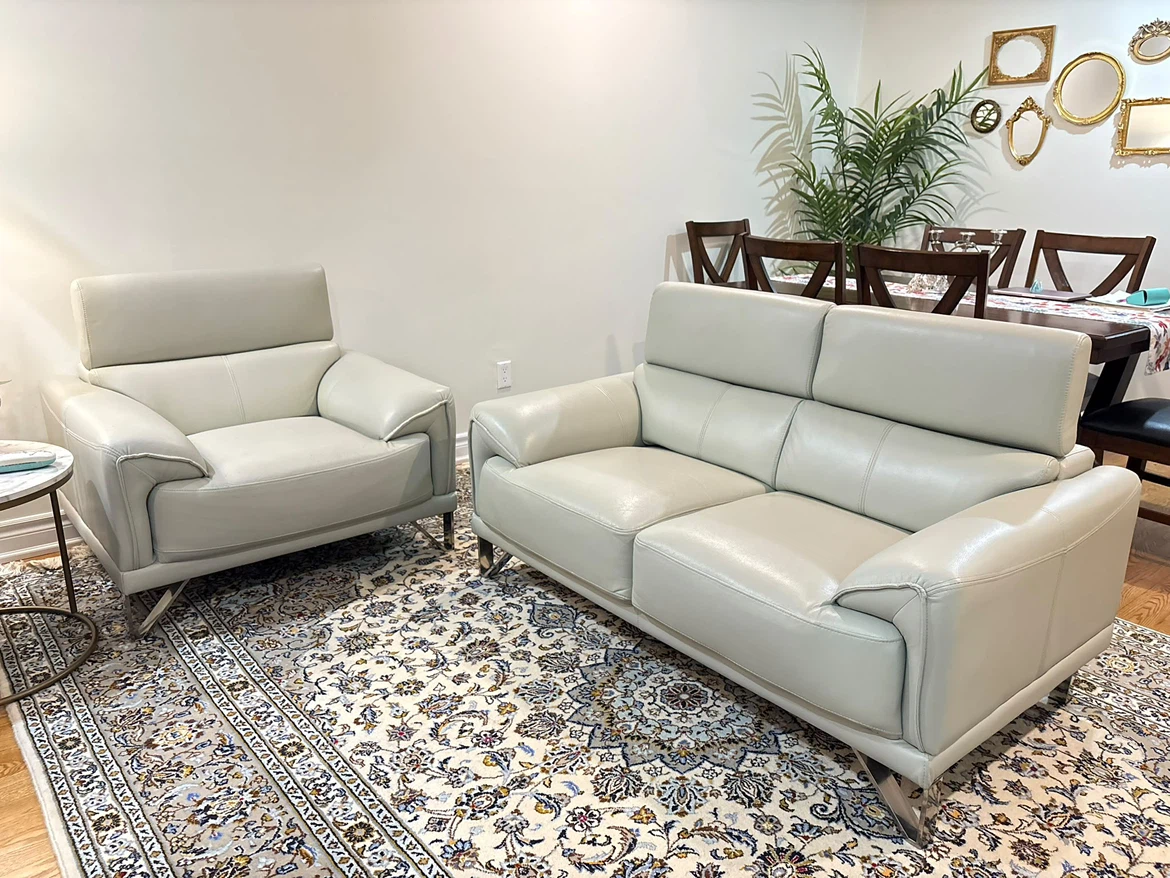 Modern light grey leather sofa and armchair set