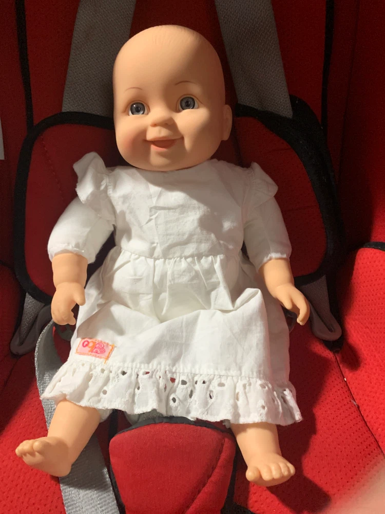 Bébé doll in white dress