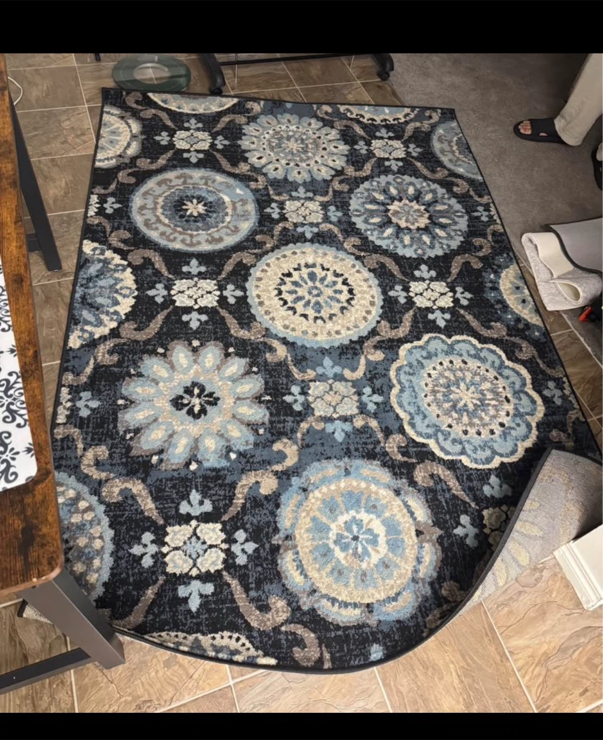 Blue and black patterned area rug