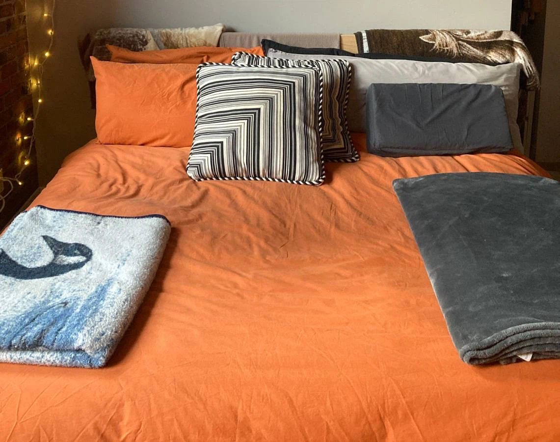 King-sized feather duvet + orange cover