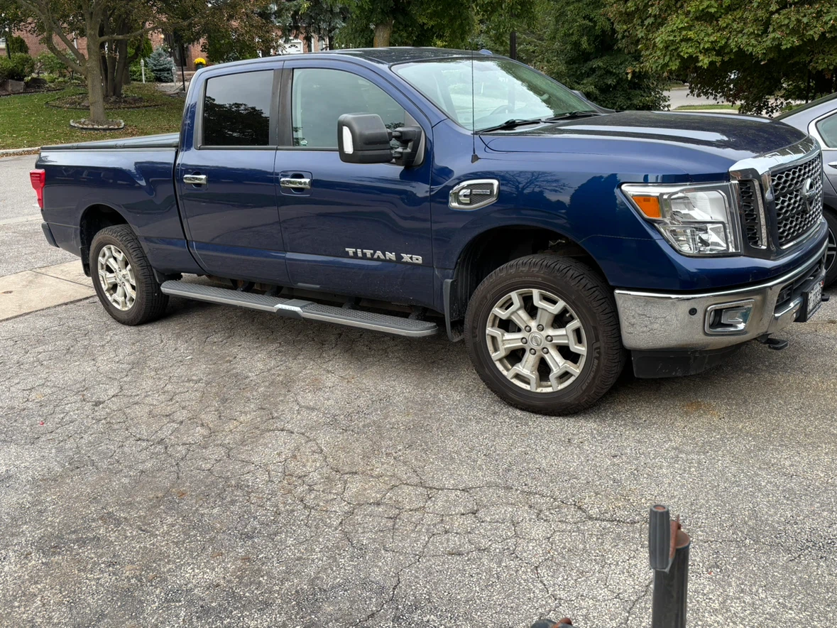 Blue Nissan Titan XD Pickup Truck