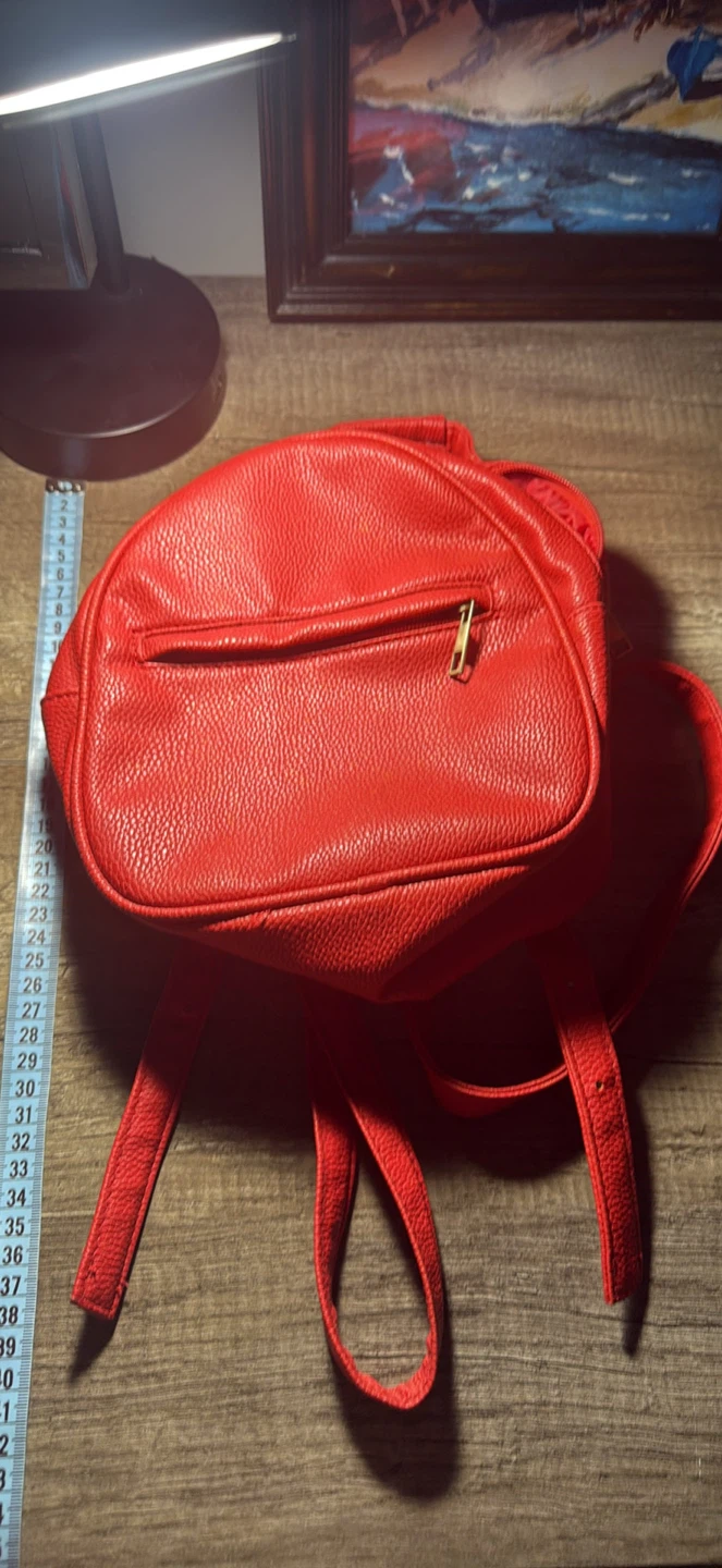 Small red leather backpack