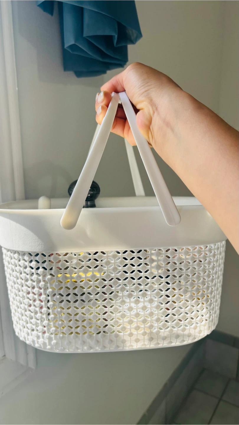 Plastic storage basket with handles